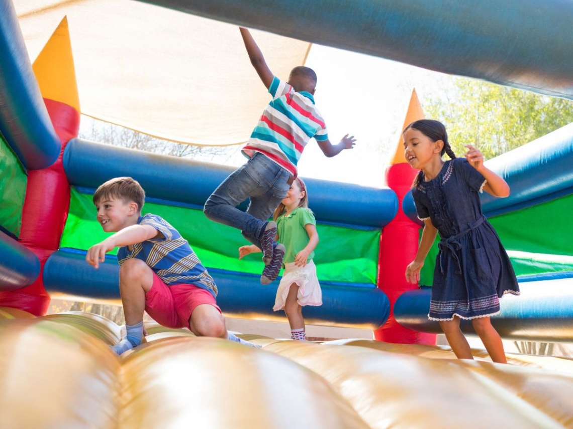 children playing in a bounce house.jpg